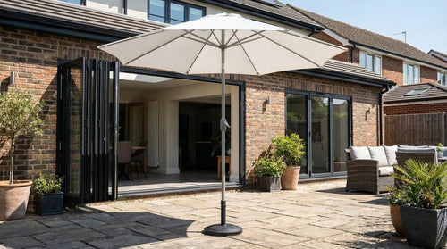 Halo 3m round centre-pole parasol shading a garden dining set in bright summer sun