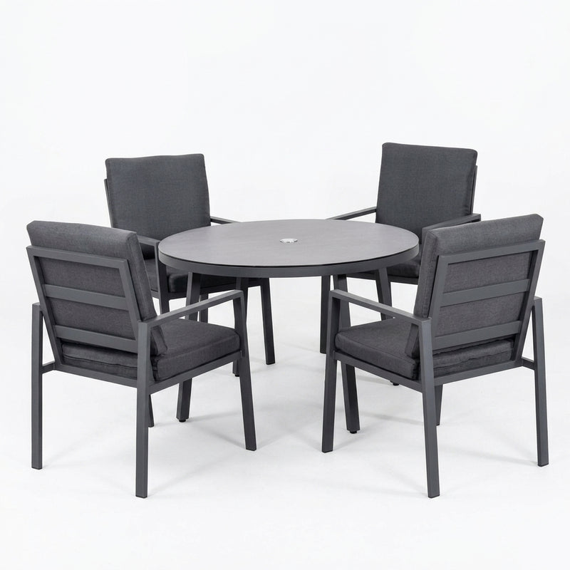 A 5-piece outdoor patio dining set featuring a round gray table and four matching armchairs with dark gray cushions, shown on a seamless white background.