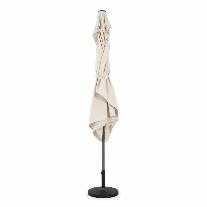 Ecru traditional patio umbrella with stand on a white background