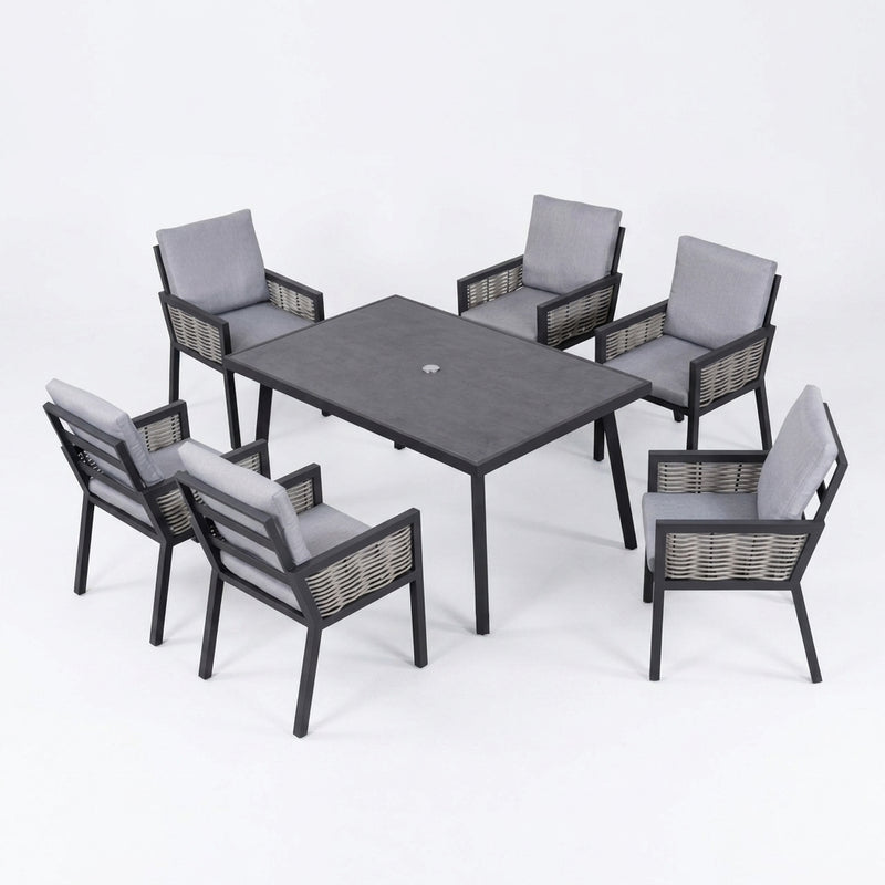 A 7-piece outdoor dining set featuring a square dark gray table and six matching armchairs with gray cushions and woven wicker-style frames, shown on a white studio background.