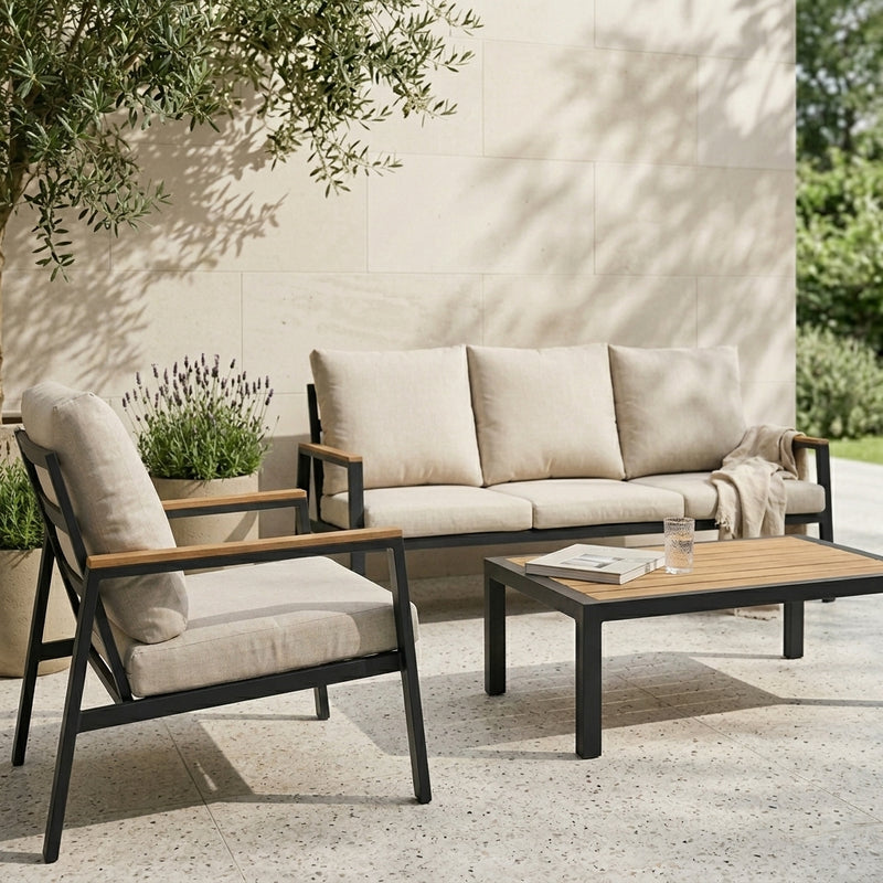 Outdoor furniture set with a sofa, chair, and coffee table on a patio.