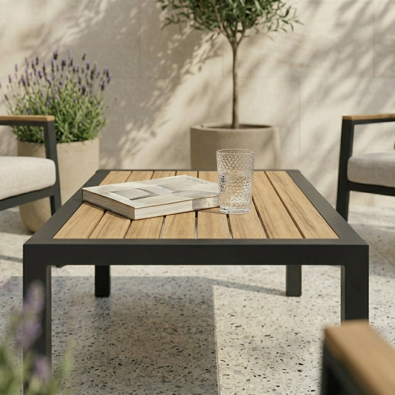 Outdoor patio set with a wooden coffee table, chairs, and potted plants.