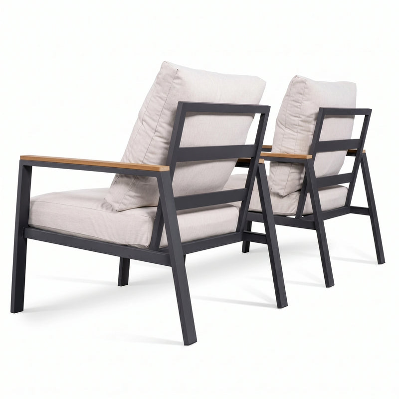 Two modern chairs with gray cushions on a white background