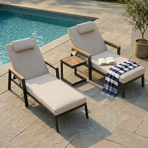 Two sunbeds and a coffee table by the pool