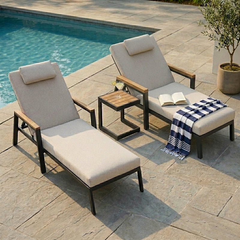 Two sunbeds and a coffee table by the pool
